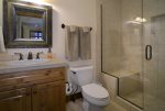 Convenient Media Room Bathroom with Walk-In Shower.